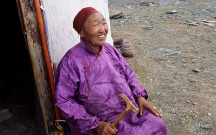 Mongolian Woman Outside Ger